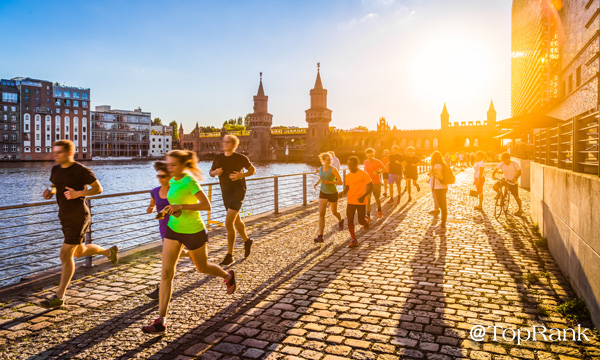 Marathon runners along canal image.